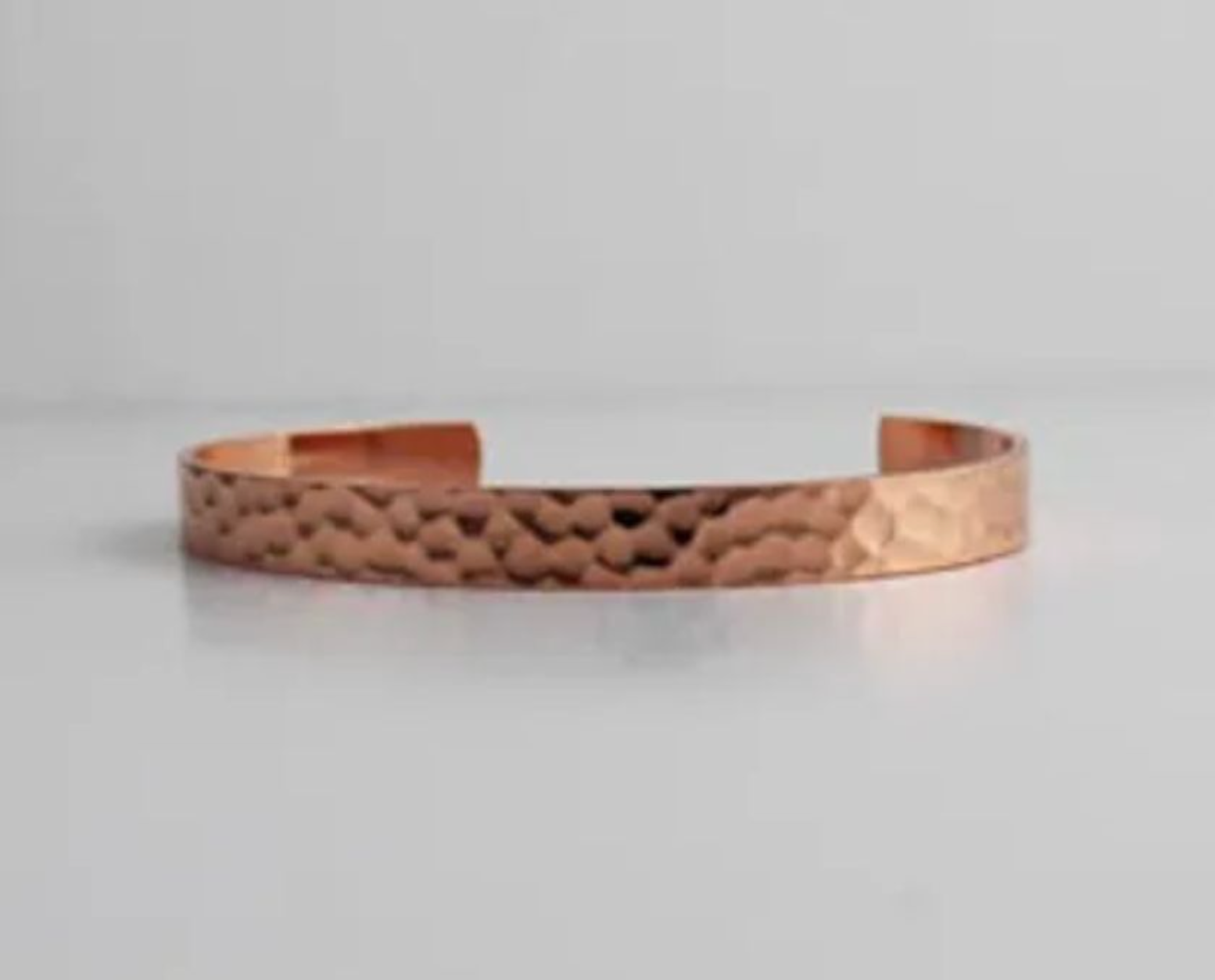 One of Moon’s hammered copper bracelets